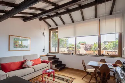 a living room with a couch and a table at Valeria Terrace - Monti, Rome in Rome