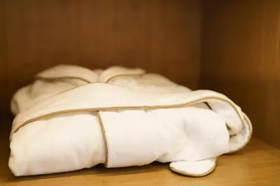 a pile of white towels sitting on a table at BDC - Luxurylifestyle in Rome