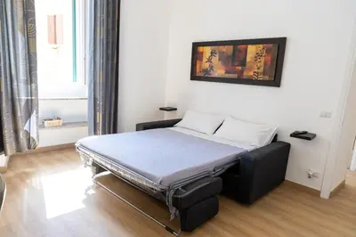 a bed sitting in a room with at MH Luxury Suite Pantheon in Rome