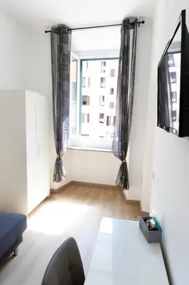 an empty living room with a large window at MH Luxury Suite Pantheon in Rome