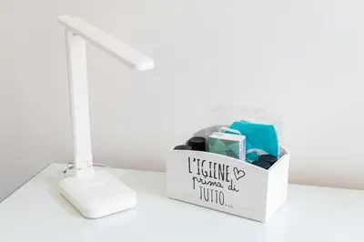 a box of tissues and a lamp on a table at MH Luxury Suite Pantheon in Rome