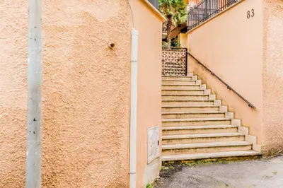 a set of stairs next to a building at Domvs Domitilla in Rome