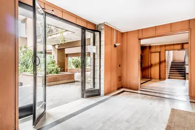 an open lobby with glass doors and a staircase at Domvs Domitilla in Rome