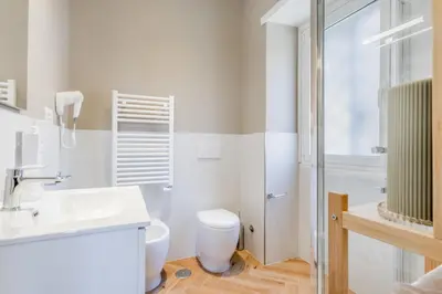a bathroom with a toilet and a sink and a shower at Domvs Domitilla in Rome