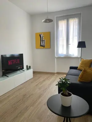 a living room with a couch and a tv at AM Apartment San Giovanni in Rome