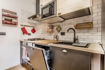 a kitchen with a sink and a stove at Inventori House in Rome