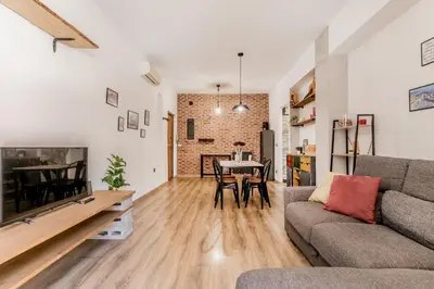 a living room with a couch and a table at Inventori House in Rome