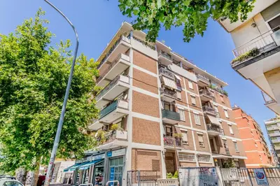 an apartment building with a street light at Inventori House in Rome