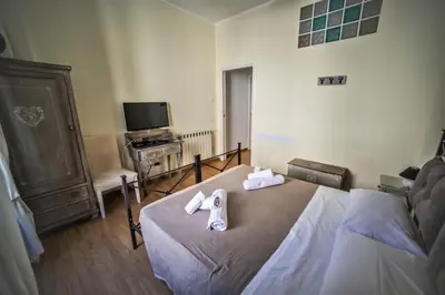 a bedroom with a bed with towels on it at Rione Monti Home in Rome