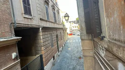 an alley with an entrance to a building at Colosseo Design Apartament in Rome