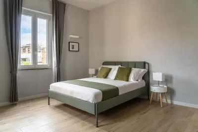 a bedroom with a bed and a window at Pigneto Apartment VaDo al Pigneto Collection in Rome