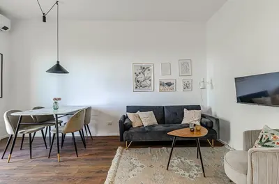 a living room with a couch and a table at Domus Campi Flegrei in Rome