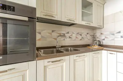 a kitchen with a sink and a microwave at iFlat Vatican Spacious Apartment with Terrace in Rome
