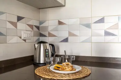 a plate of food on a table with a plate of food at iFlat Vatican Spacious Apartment with Terrace in Rome