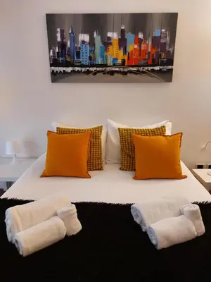a bedroom with a bed with two towels on it at Monti Parioli de Charme in Rome