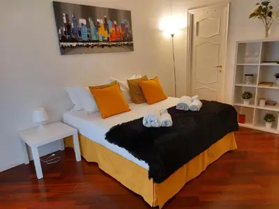 a bedroom with a bed with towels on it at Monti Parioli de Charme in Rome