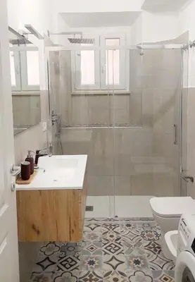 a bathroom with a shower and a sink and a toilet at Mimmi's house in Rome