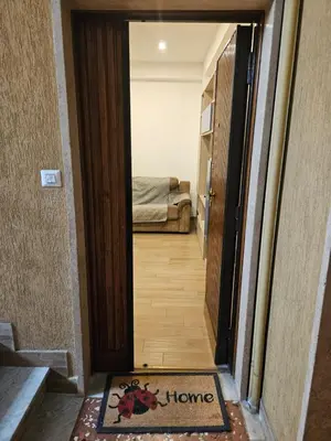 a hallway with a door leading to a bedroom at La Casa di Fede in Rome