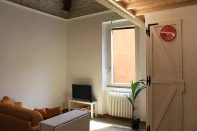 a living room with a couch and a sliding door at Epirhome, tra Colosseo e Porta Santa in Rome