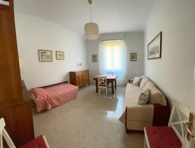 a living room with a couch and a table at Casa vacanza Brandi in Rome