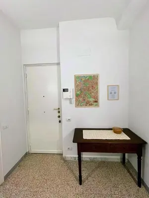 a small room with a table and a door at Casa vacanza Brandi in Rome