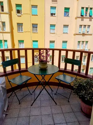 a table and two chairs on a balcony at Casa vacanza Brandi in Rome