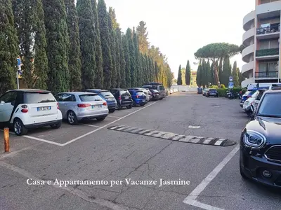 a bunch of cars parked in a parking lot at Casa e Appartamento per Vacanze JASMINE in Rome