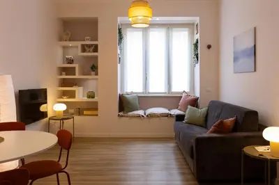 a living room with a couch and a window at DaliTourism - La Casa di Pida Vatican Apartment in Rome