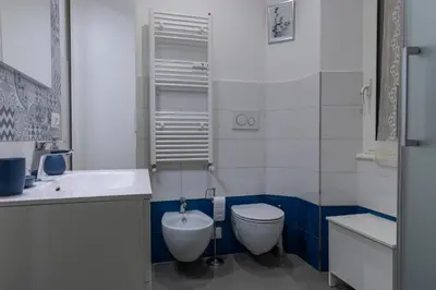 a bathroom with a toilet and a sink at DaliTourism - La Casa di Pida Vatican Apartment in Rome