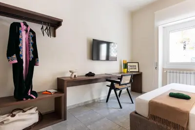 a bedroom with a desk and a bed at Vatican Loft - San Pietro in Rome