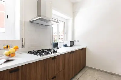 a kitchen with a stove and a counter top at Vatican Loft - San Pietro in Rome