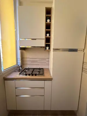 a kitchen with a stove and a refrigerator at La Casa di Léon - Battistini - Vaticano in Rome