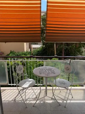 two chairs and a table on a balcony at La Casa di Léon - Battistini - Vaticano in Rome