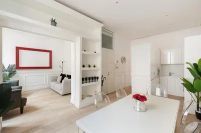 a white living room with a couch and a table at Crystal Home Piazza Navona in Rome
