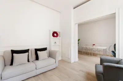 a white living room with a couch and a table at Crystal Home Piazza Navona in Rome