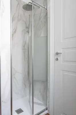 a shower with a glass door in a bathroom at Appartamento con 2 camere e 2 bagni -San Giovanni- in Rome
