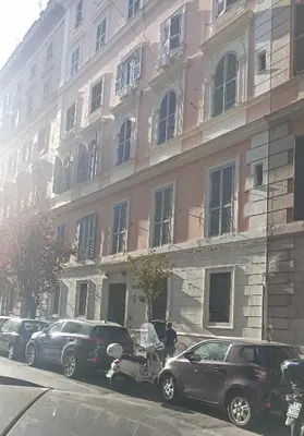 a car that is parked in front of a building at Famy in Rome