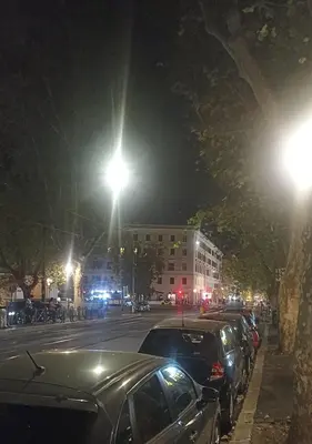 a street at night with cars parked on the street at Famy in Rome