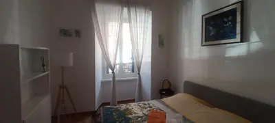 a bedroom with a bed and a window at Famy in Rome