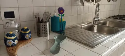 a kitchen counter with a sink and a kitchen utensils at Famy in Rome