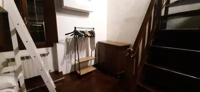a room with a staircase and a wooden floor at Navona in Love in Rome