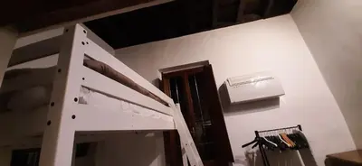 a room with a ladder and a air conditioner on a wall at Navona in Love in Rome