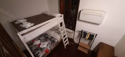 a room with a refrigerator with a ladder and a freezer at Navona in Love in Rome
