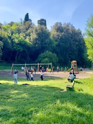 a group of people playing in a park at Olimpia Bis - Gianicolo - Trastevere - Vaticano - Centro Storico di Roma in Rome
