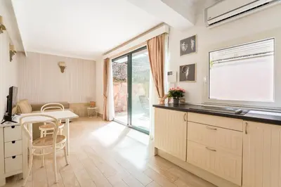 a kitchen with a table and a dining room at Flaminio Garden, Indenpent Flat 10 min from the City Center in Rome