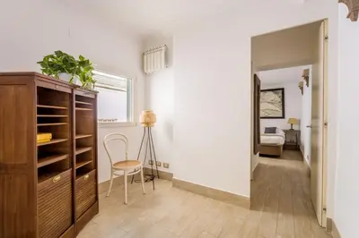 a room with a closet and a table and a chair at Flaminio Garden, Indenpent Flat 10 min from the City Center in Rome