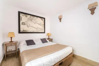 a bedroom with a large bed and two night stands at Flaminio Garden, Indenpent Flat 10 min from the City Center in Rome