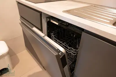 a dishwasher with its door open in a kitchen at Domus in Lauro in Rome