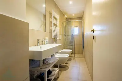 a bathroom with a sink and a toilet at Domus in Lauro in Rome