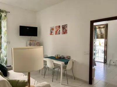 a dining room with a table and chairs at Home Rome in Rome